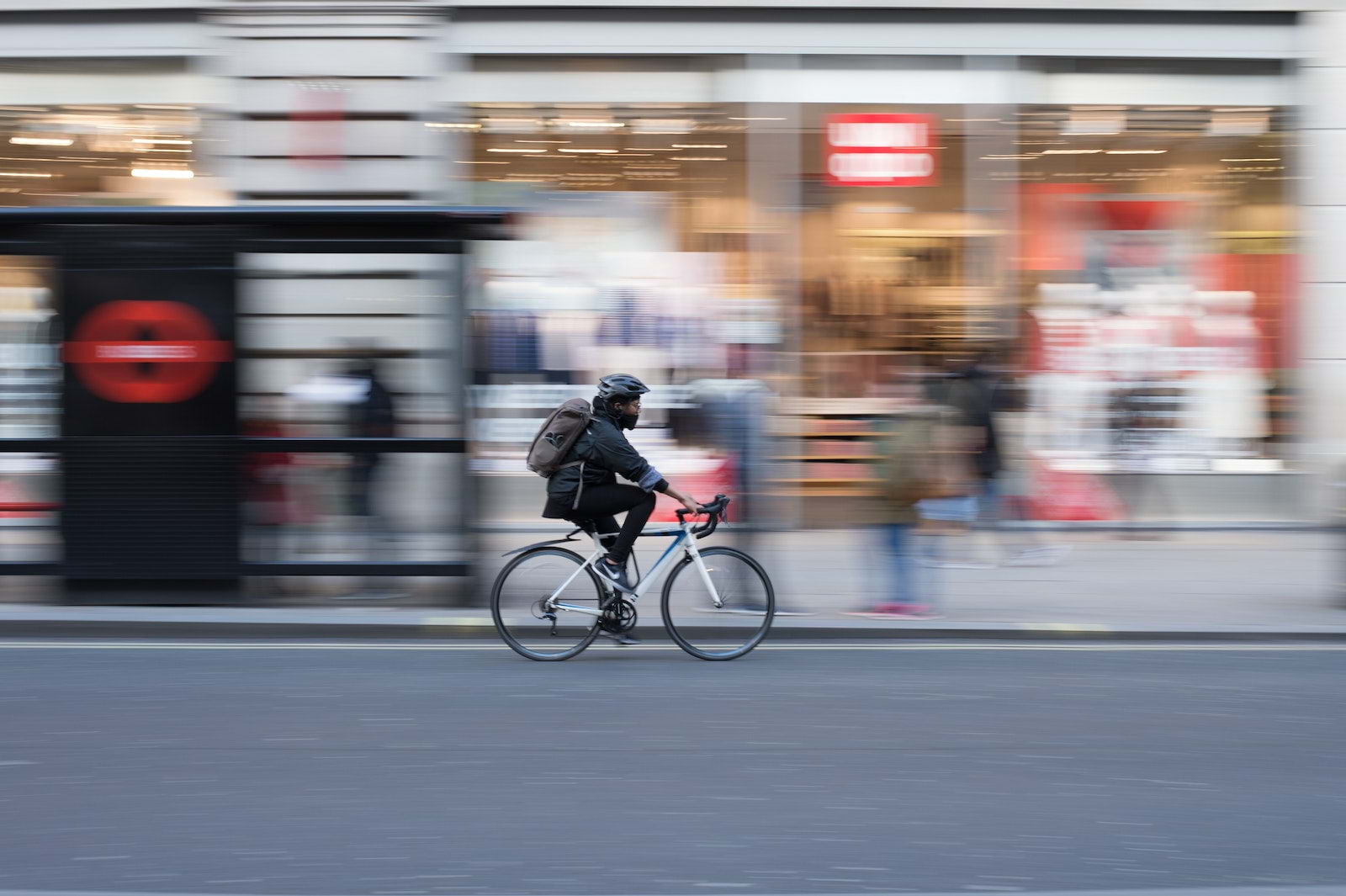 A cyclist riding through central London
