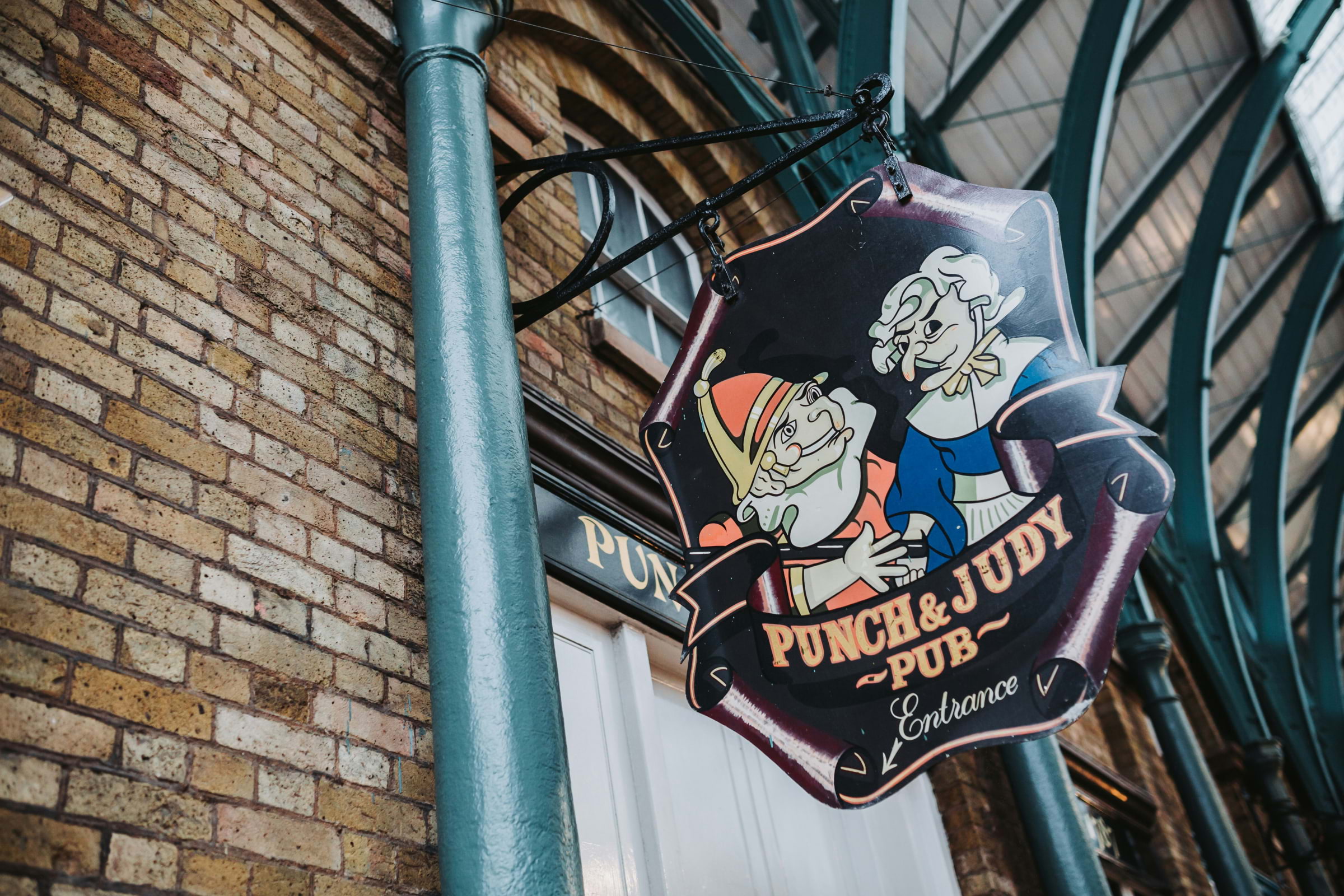 The Punch & Judy pub entrance sign in London