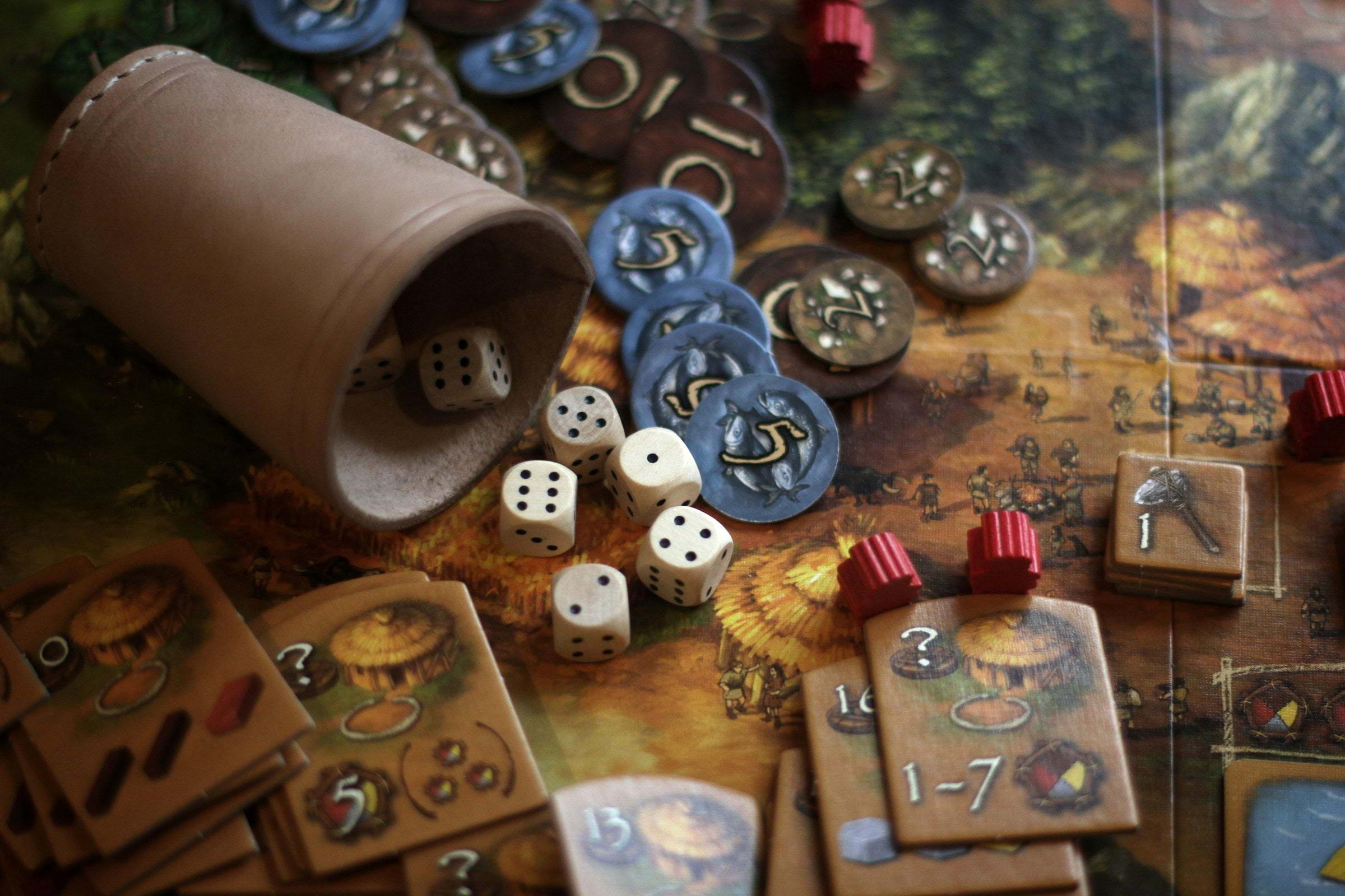 Dice, tokens, and other tabletop gaming objects on a table