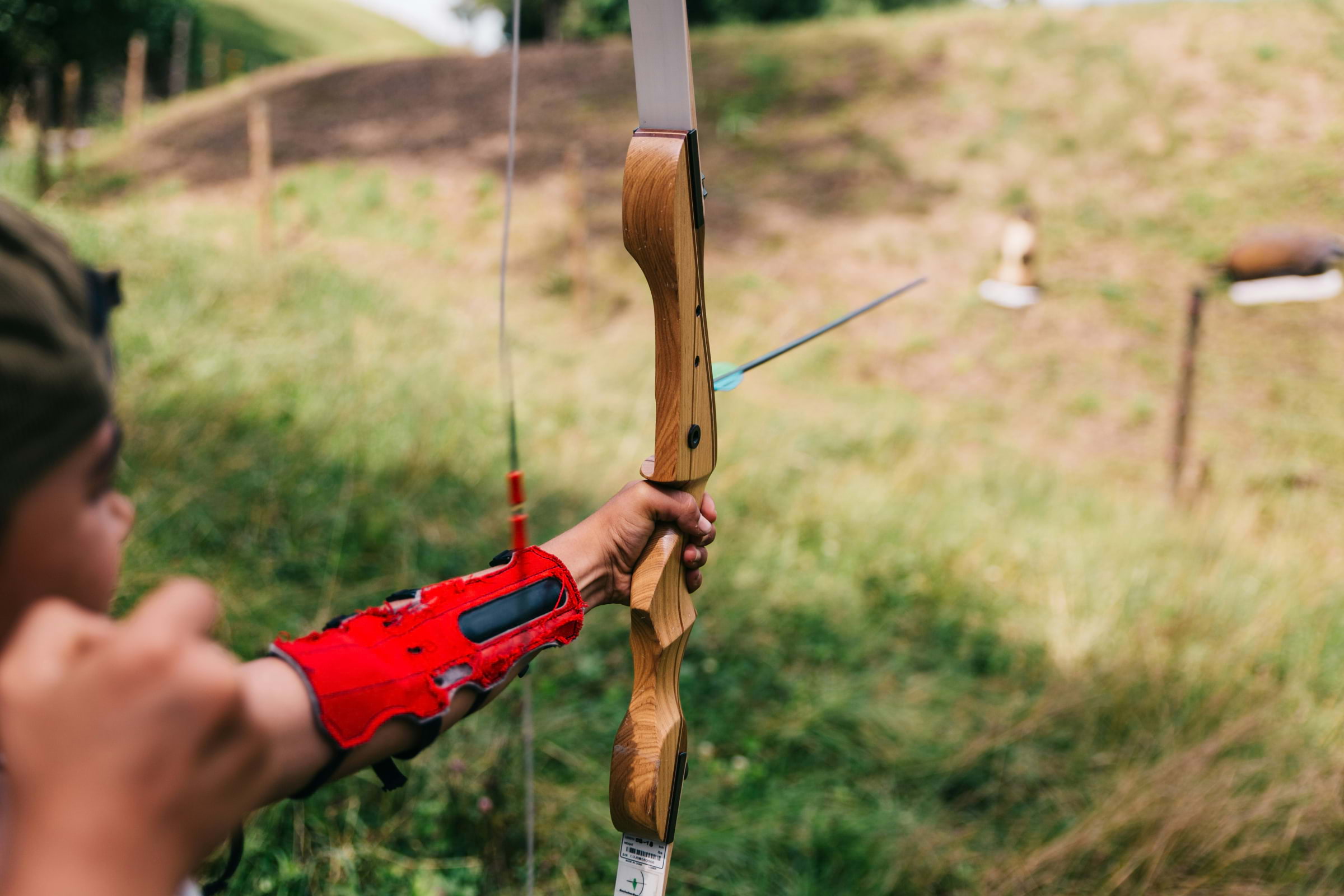 A bow and arrow being pulled from a first-person perspective