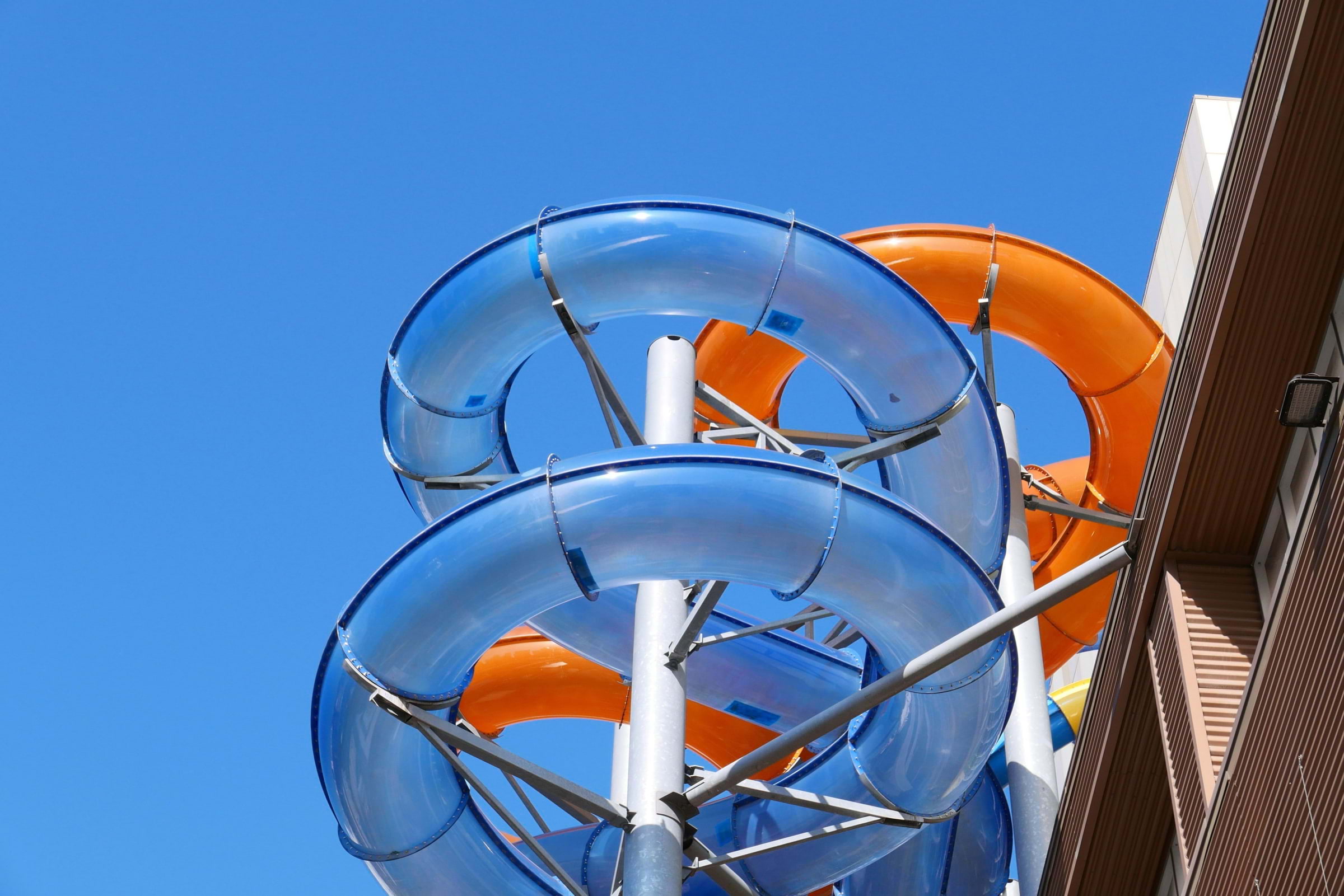 A waterslide full of twists and turns on the outside of a building