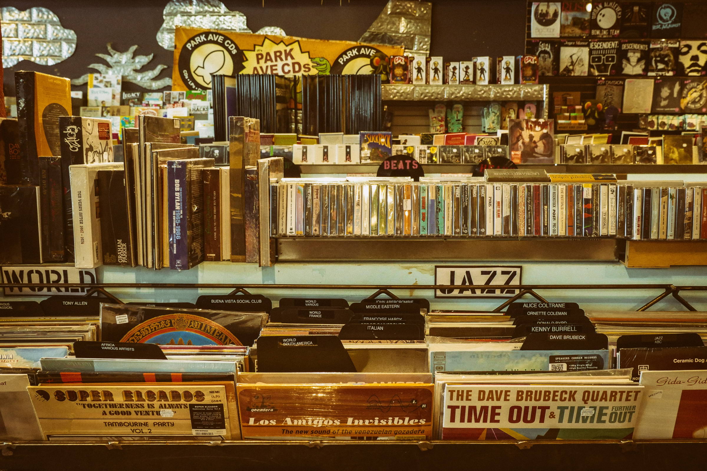 A record shop displaying records in containers and on shelves.