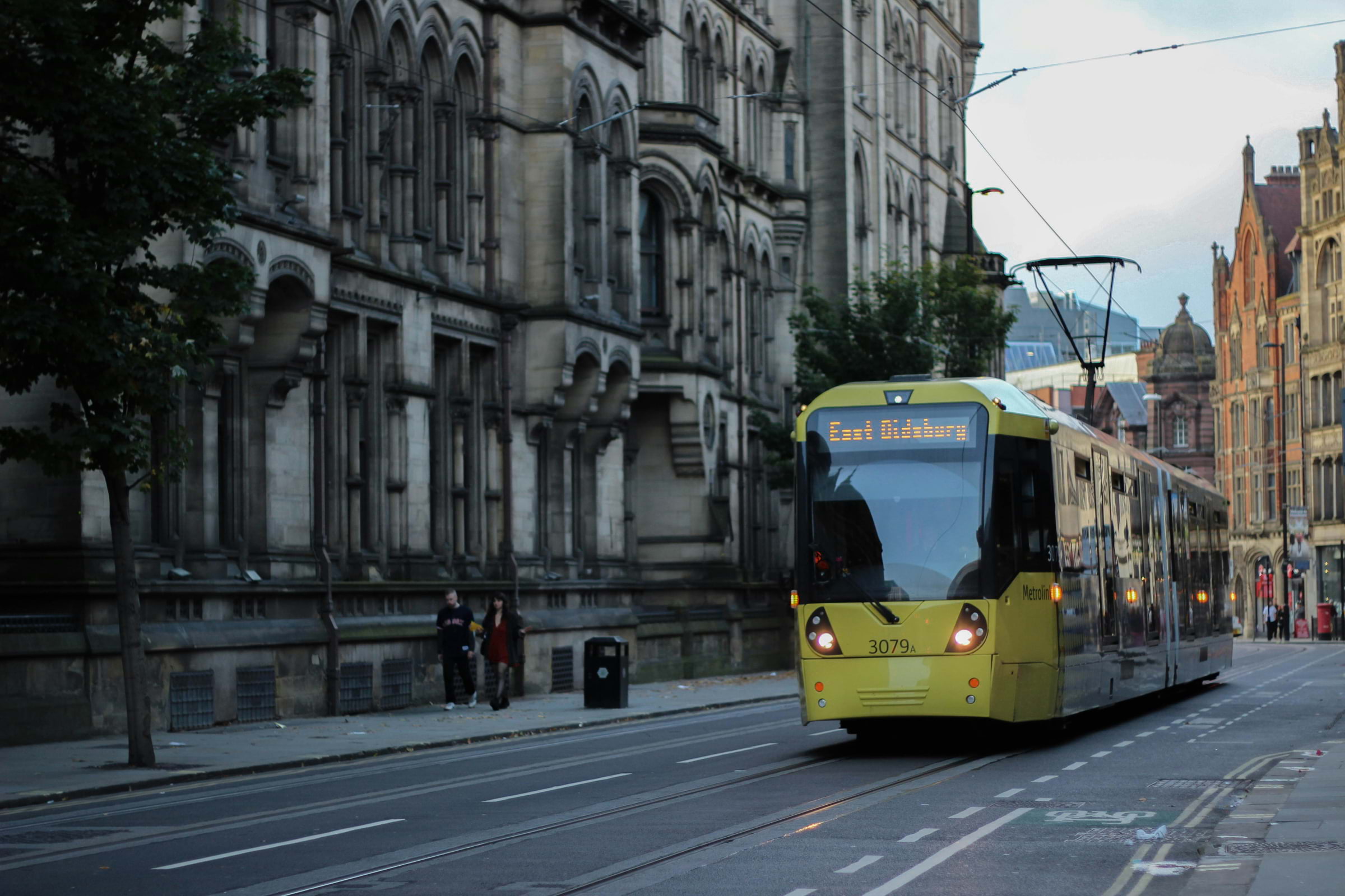 A Didsbury tram driving through Manchester city centre