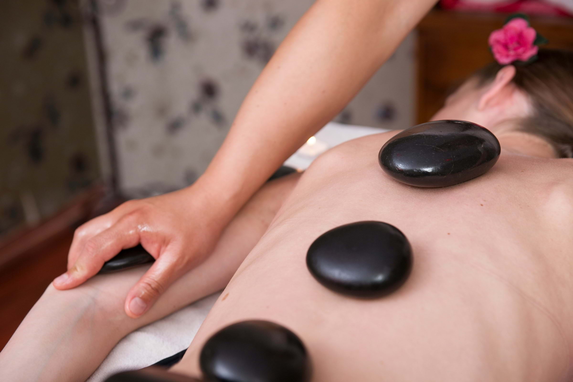Woman having a hot stone massage