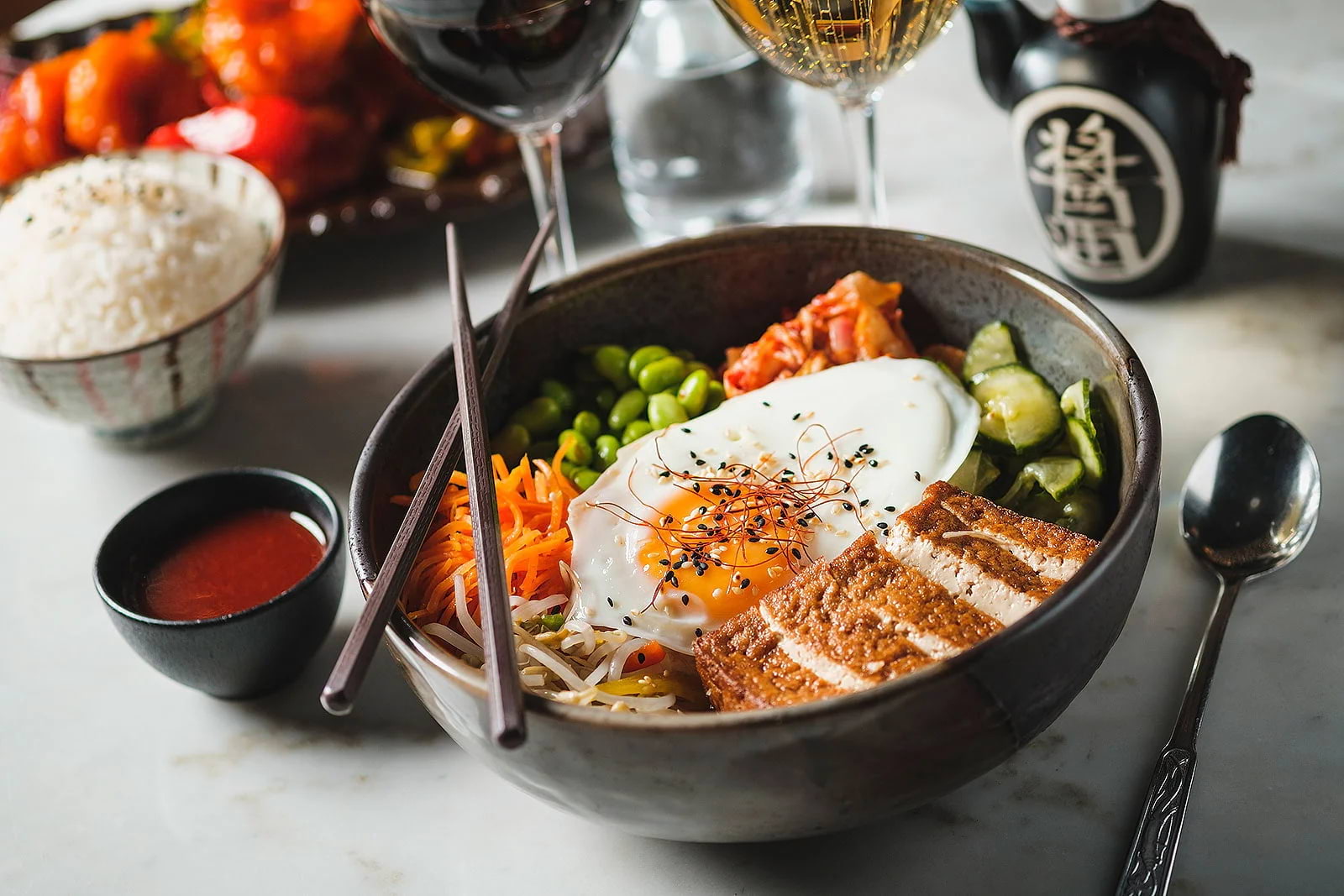 A Korean rice bowl on a restaurant table