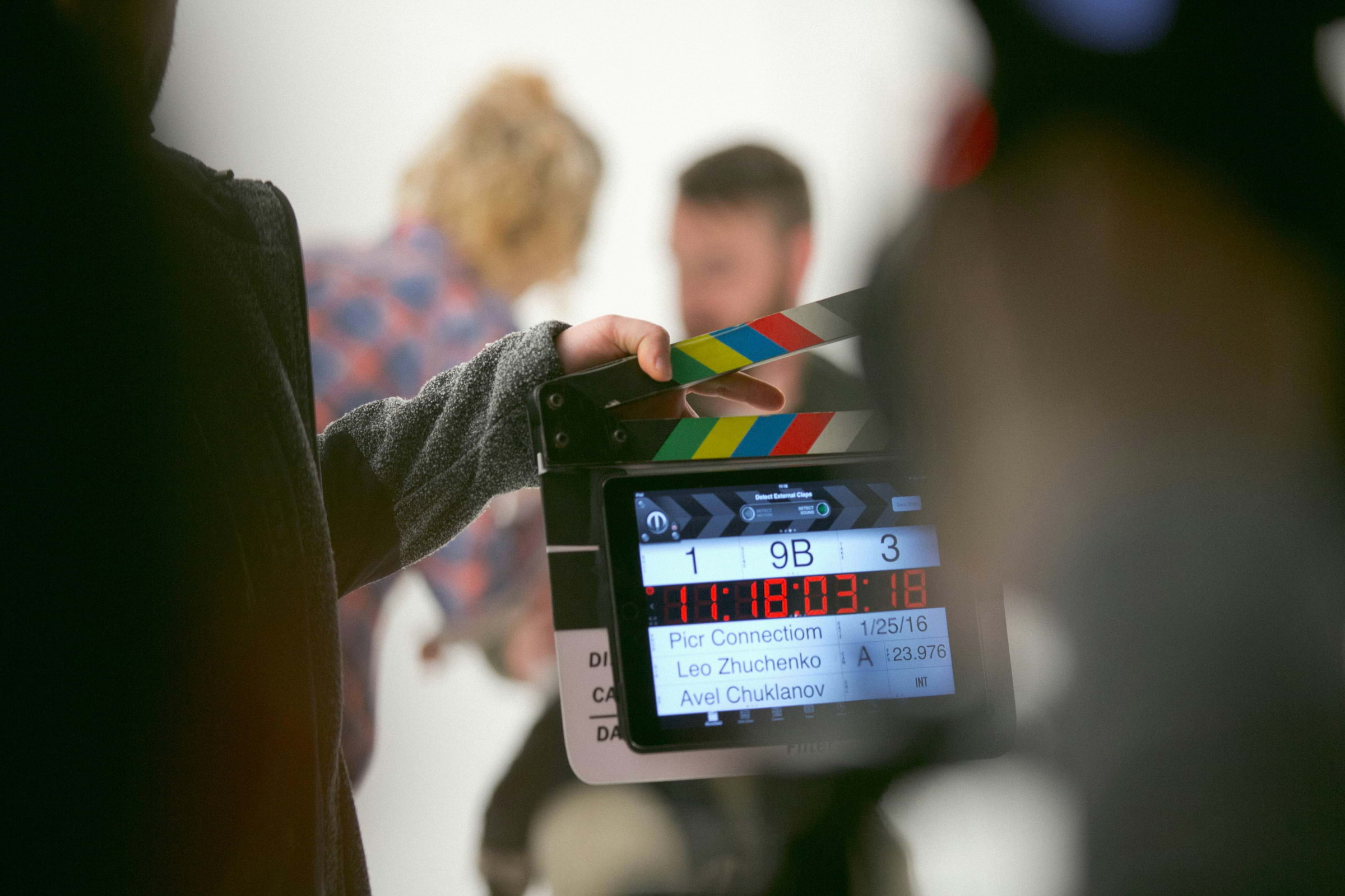 A clapper board with a blurred background