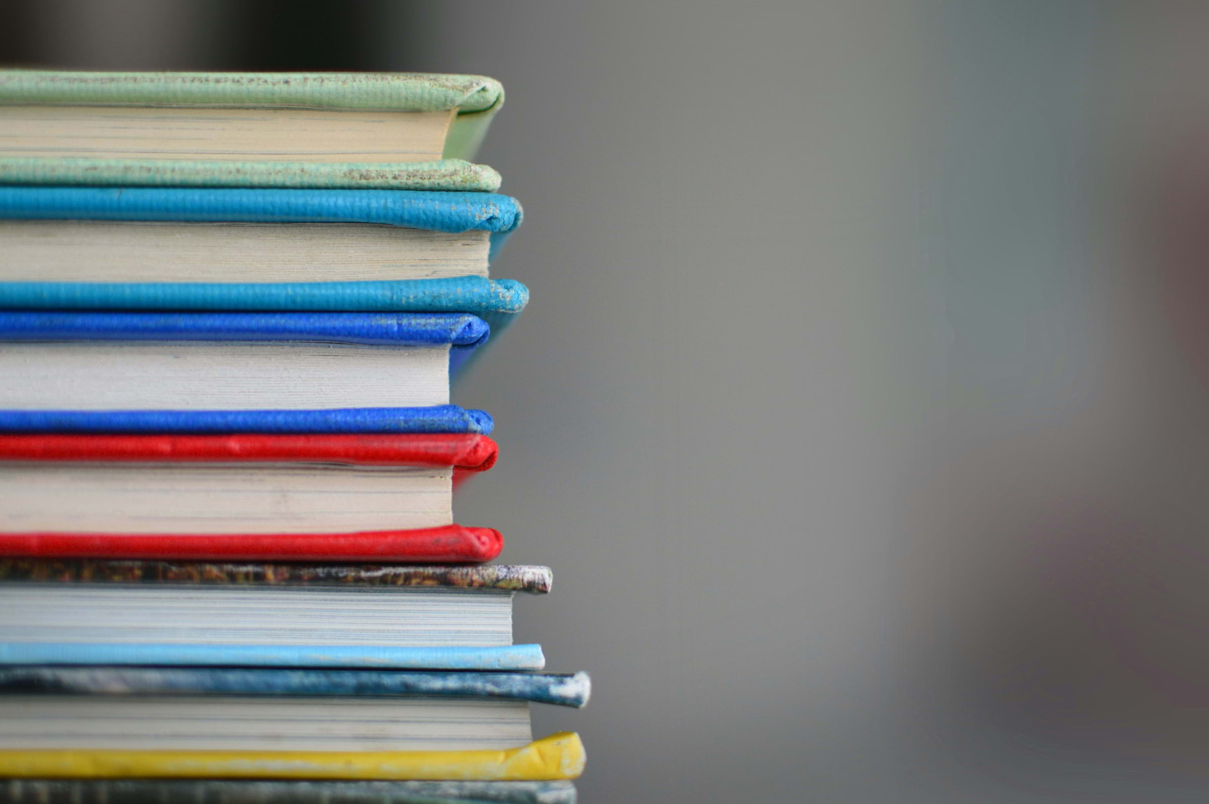 A pile of books with different coloured covers