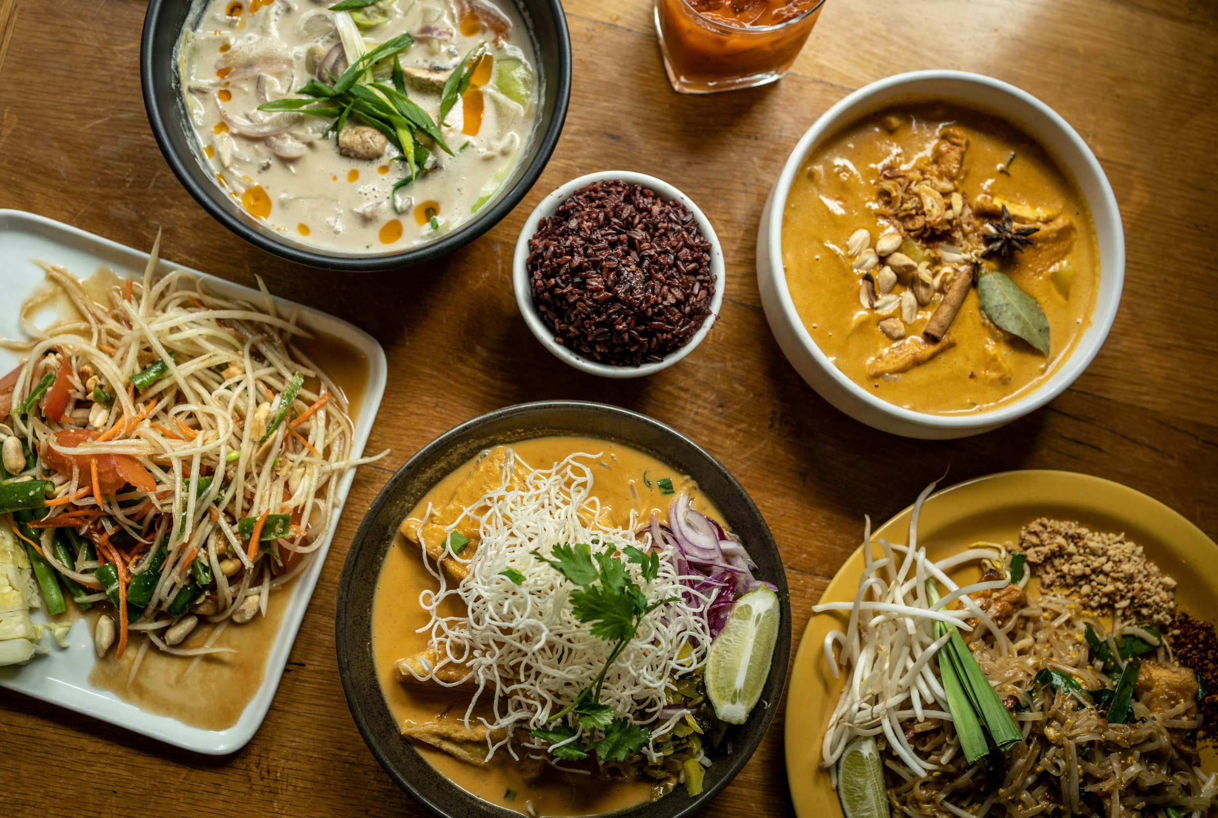 Bowls of colourful Thai food from above