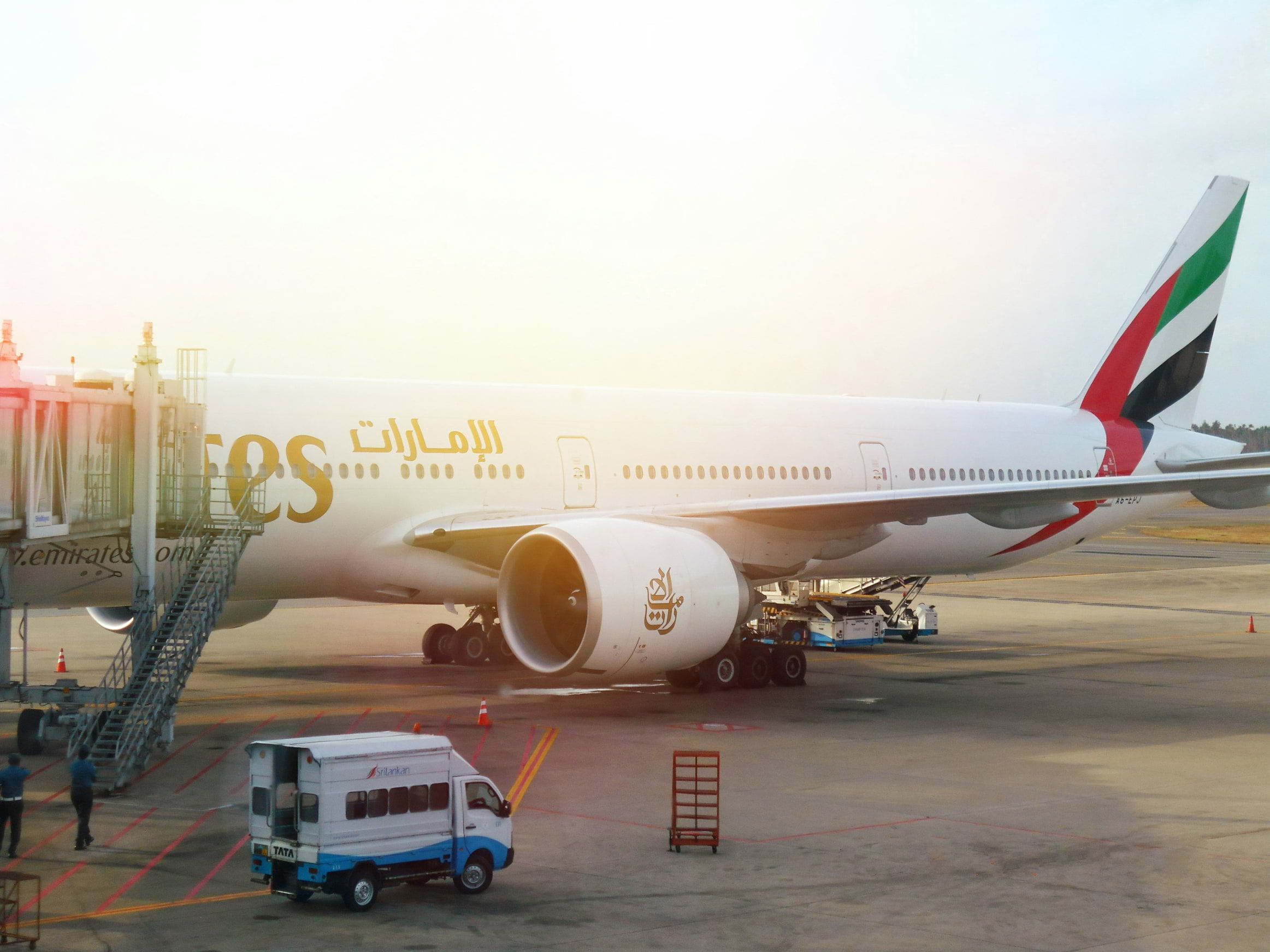 An Emirates plane on the airport tarmac