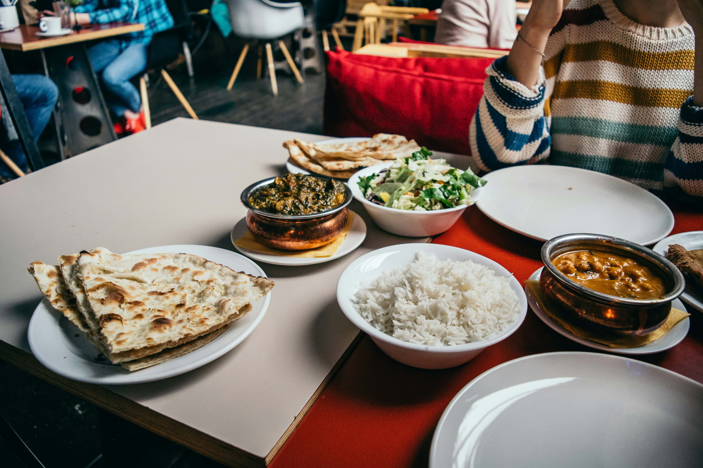 A spread of Indian food on a table