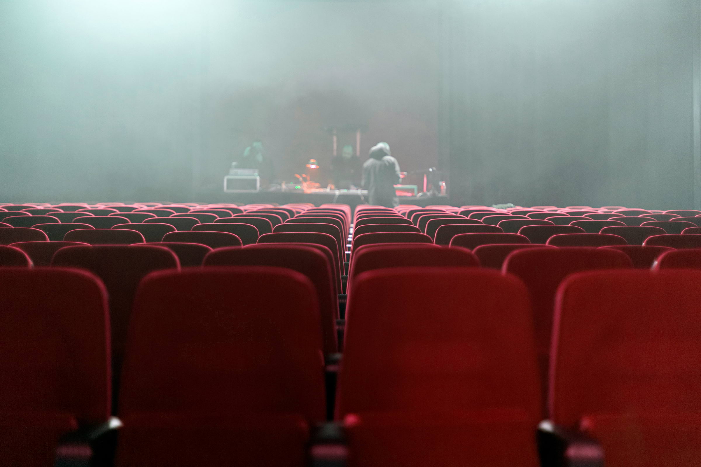 Cinema chairs in a smokey room