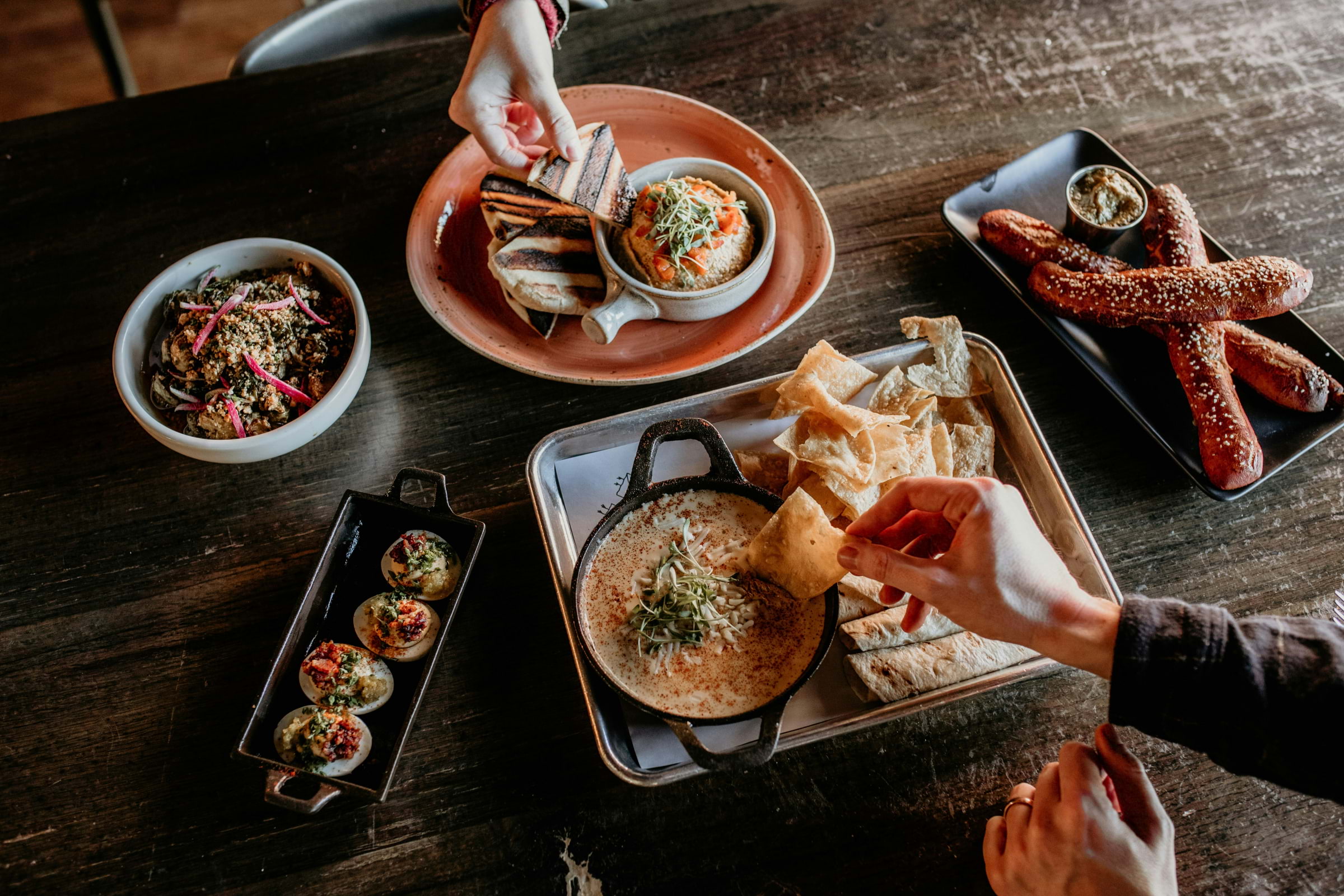 A spread of vegan food on a wooden table