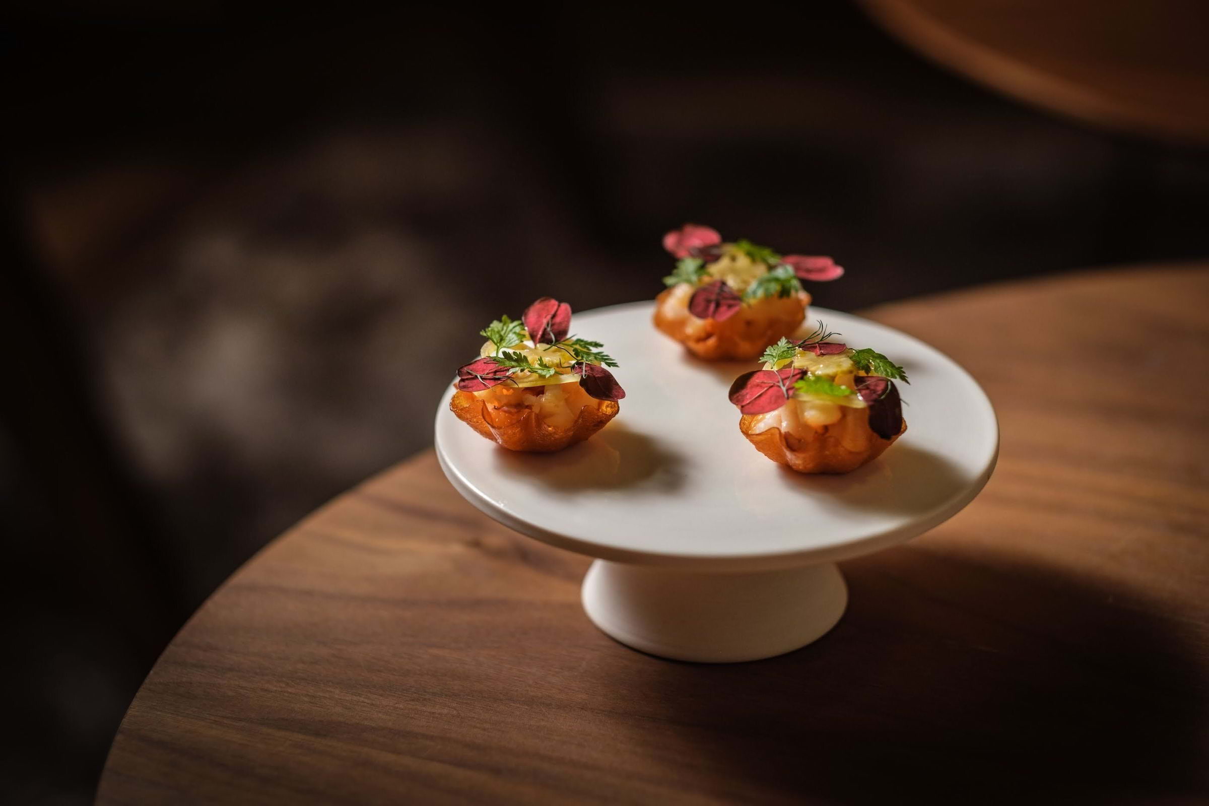 Små rätter på ett fat på restaurang Signum.