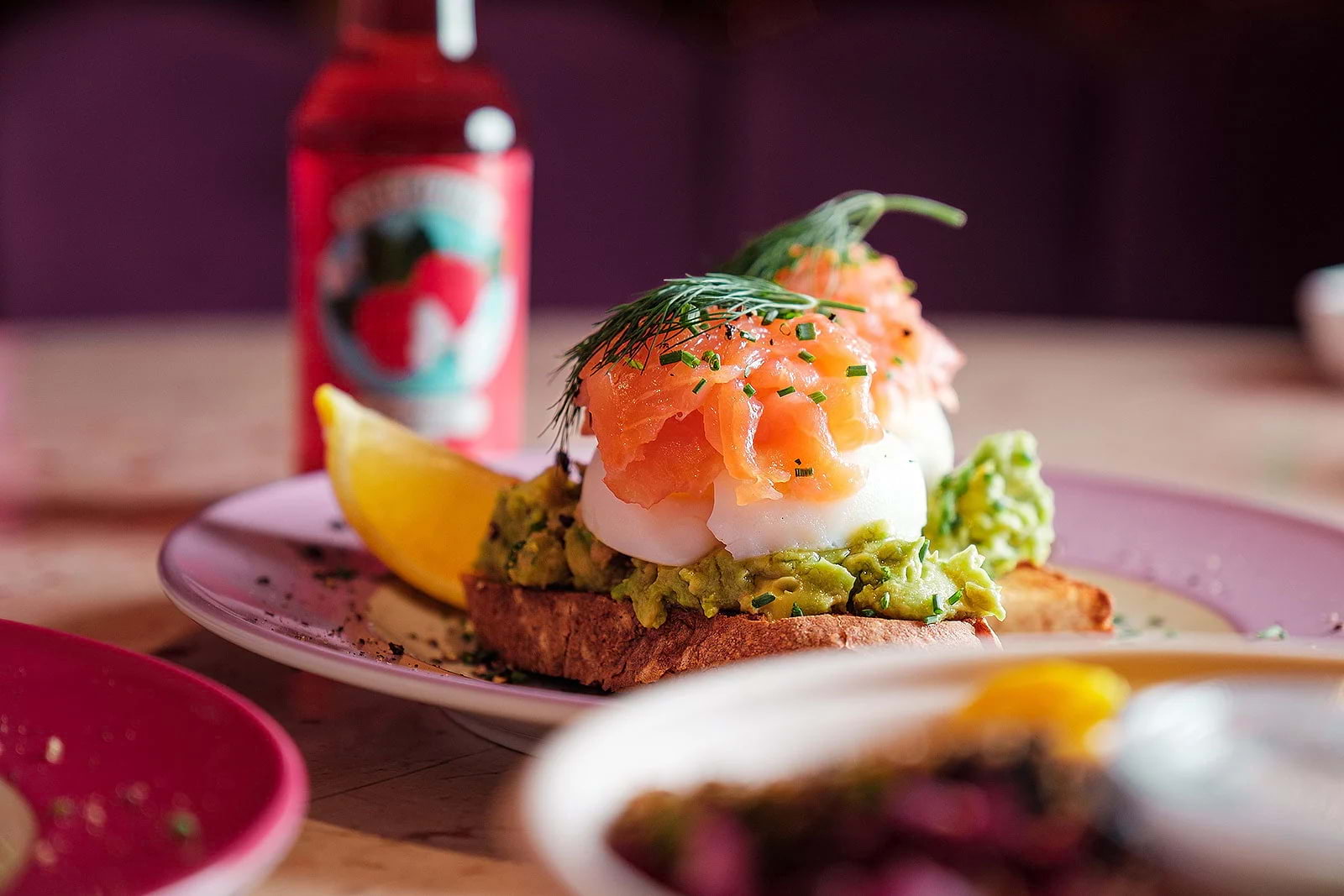 Poached eggs and salmon on smashed avocado toast