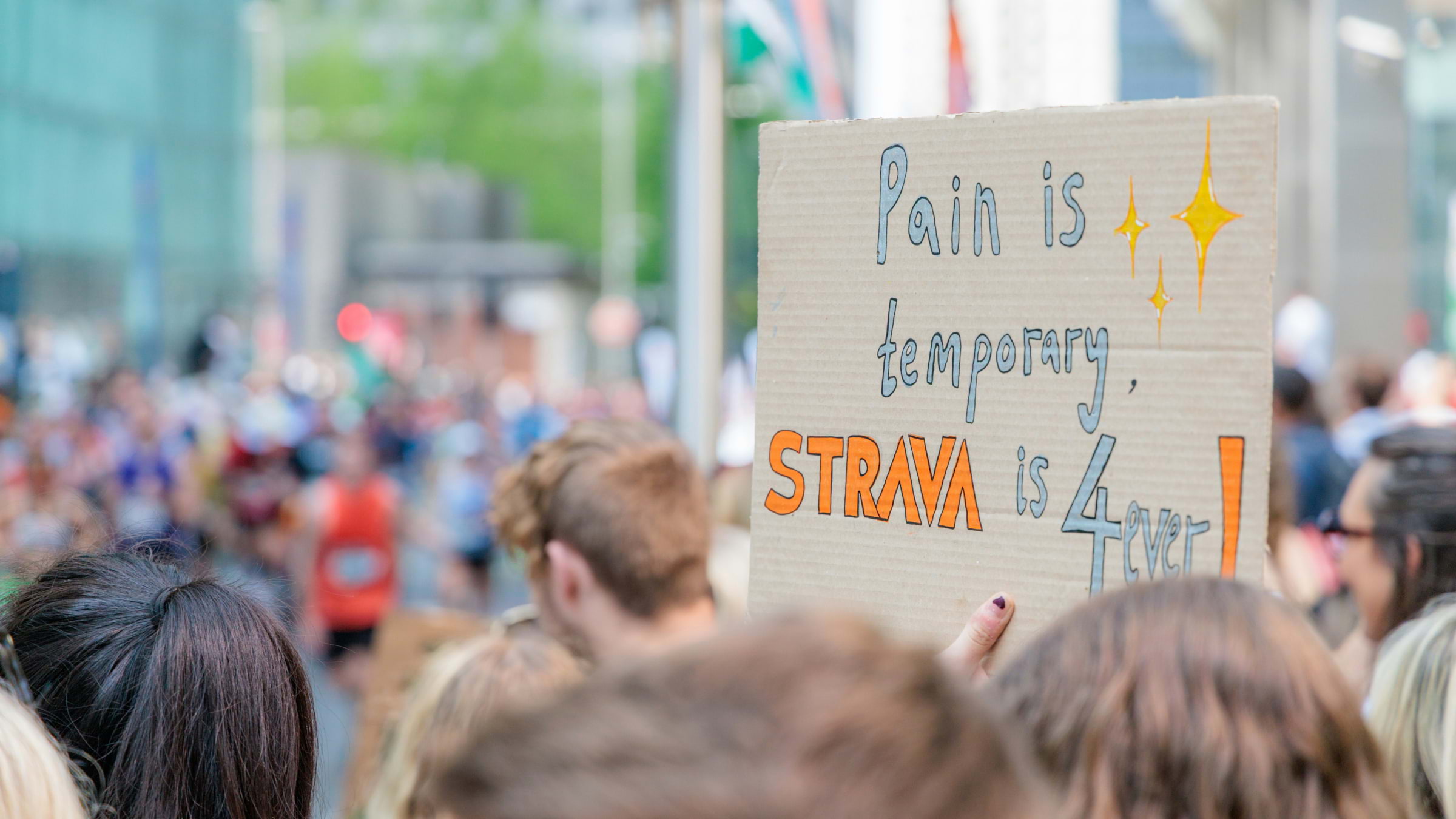 A sign saying 'pain is temporary, Strava is 4 ever'