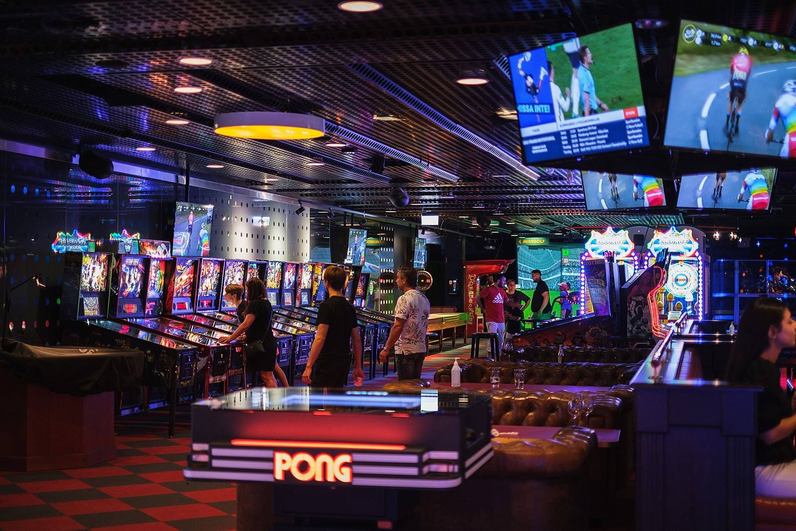 The interior of an arcade with glowing games