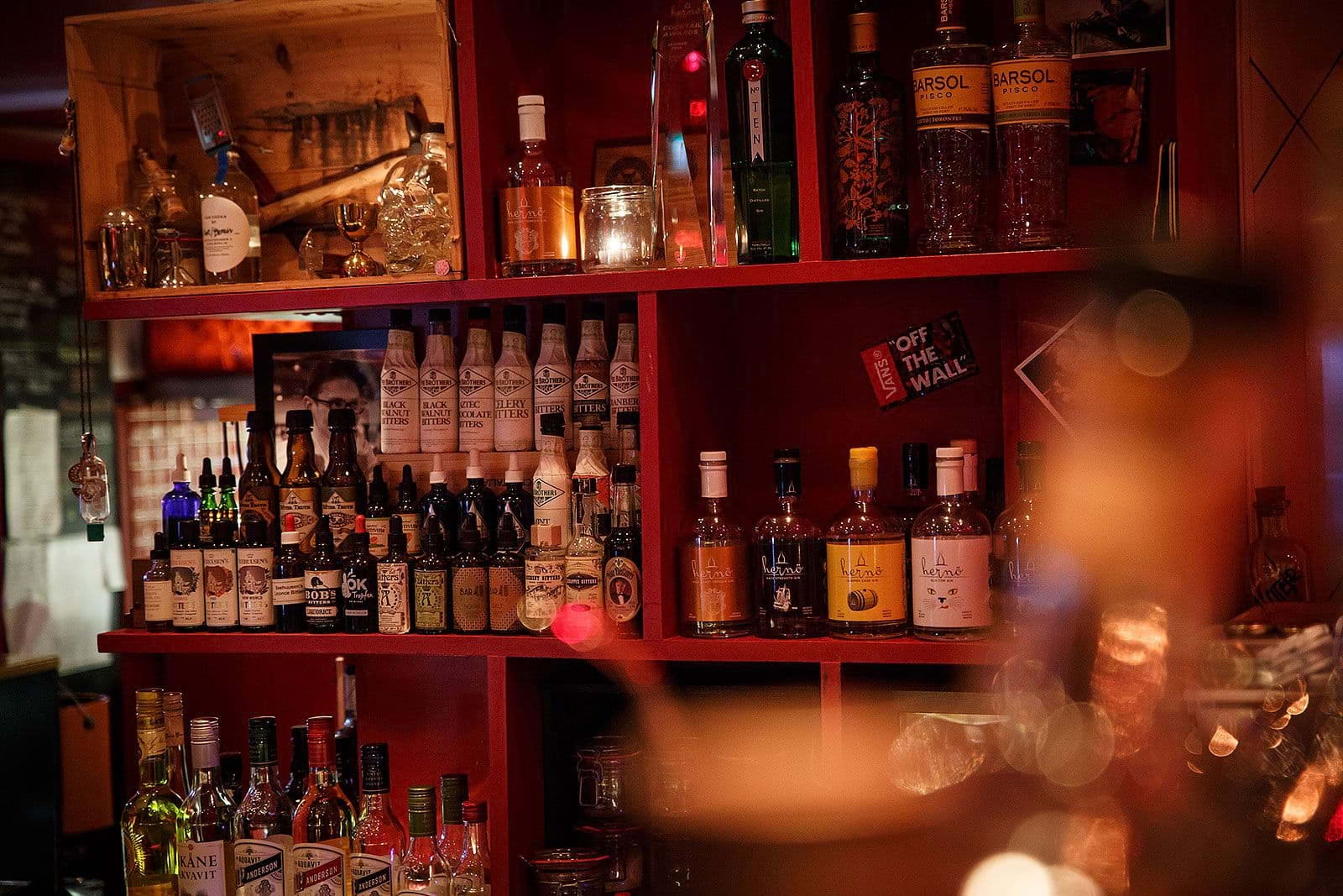 Bottles of spirits on shelves in a cocktail bar