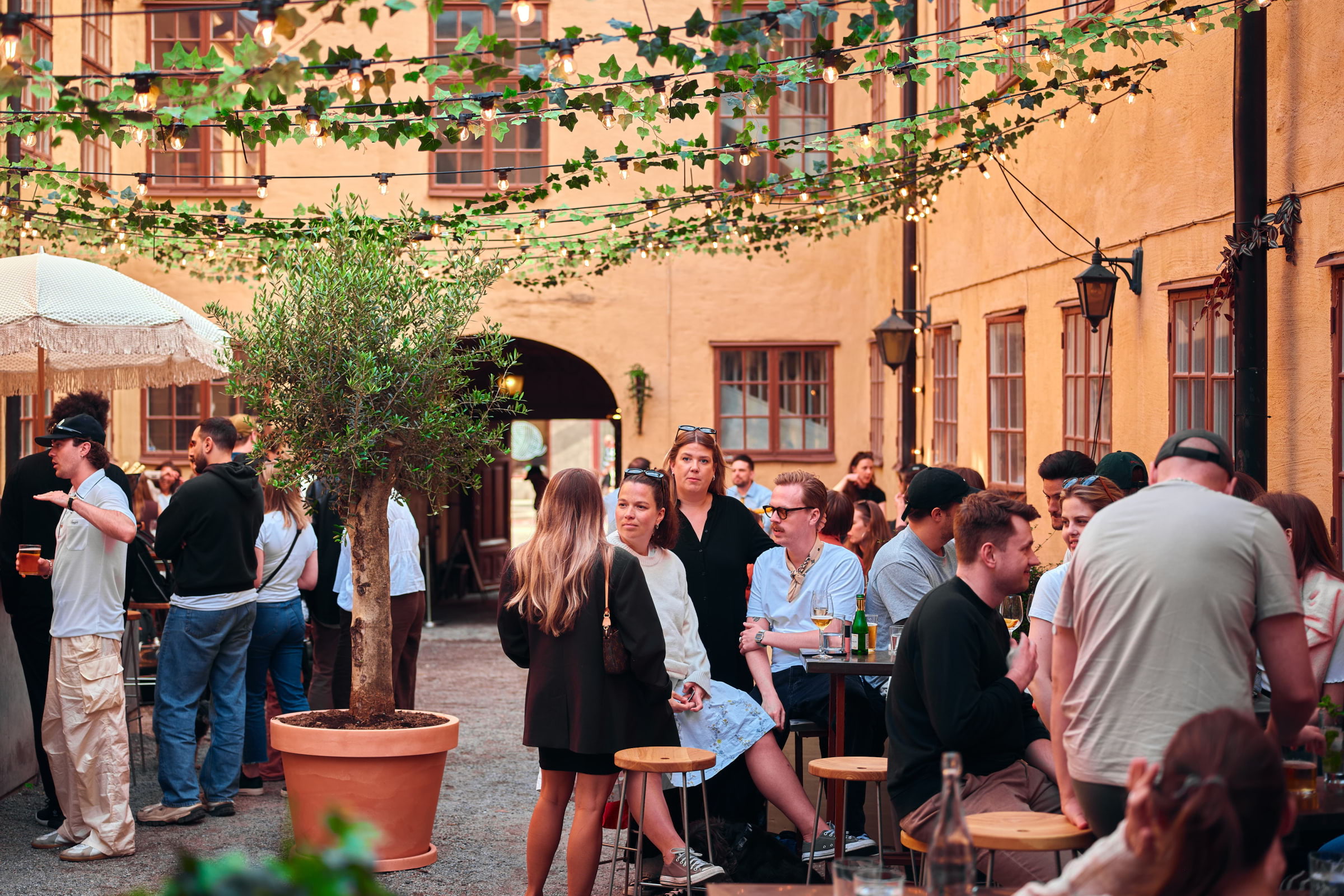 People enjoying drinks in an outdoor bar area