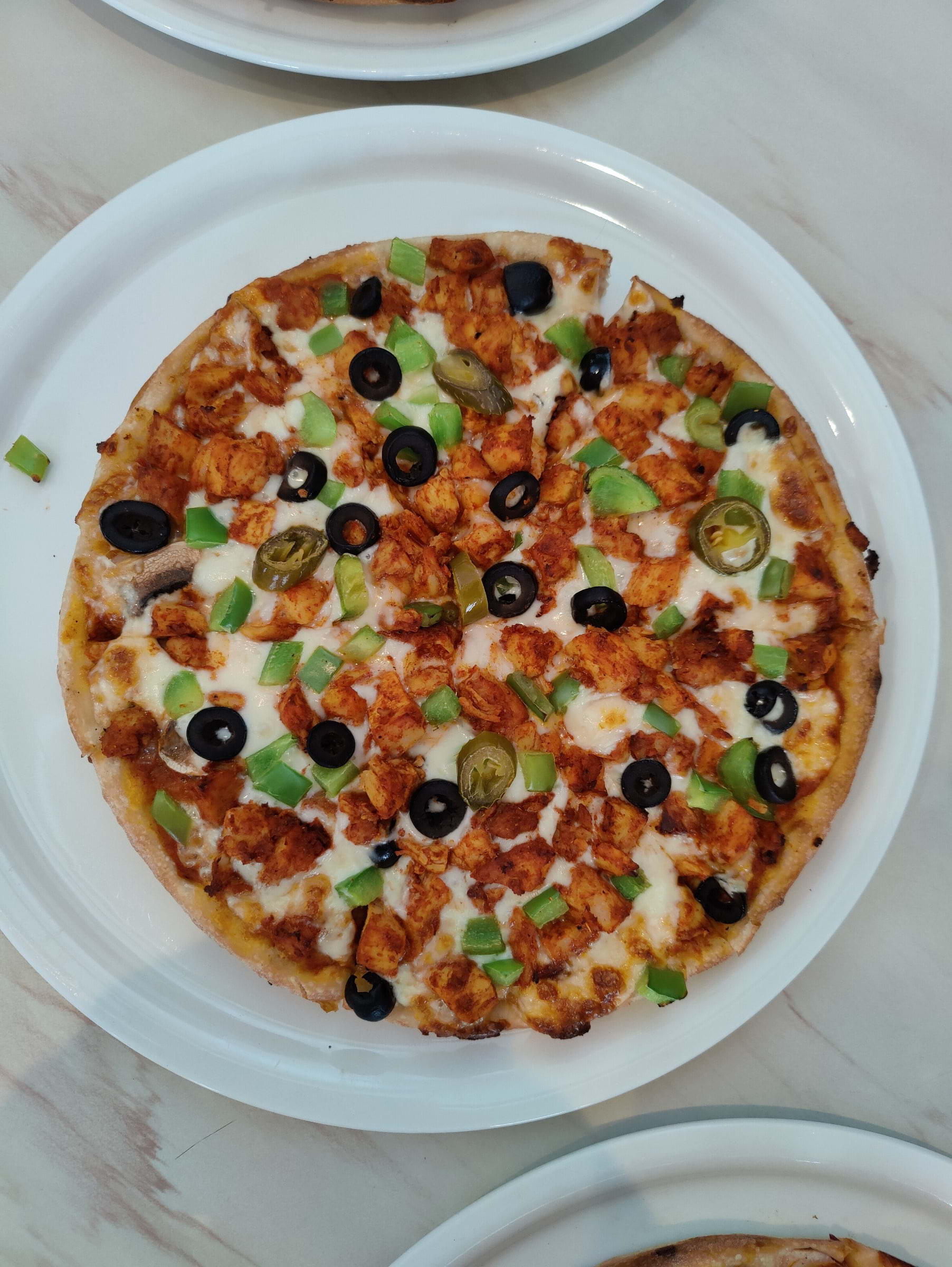 Chicken Tikka Pizza – Bild från Papa's Pizzeria av Shahzad A. (2024-07-19)